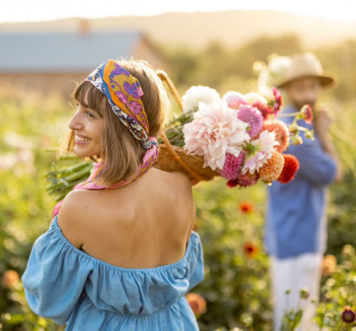 Woman holding dahlia flowers from her garden